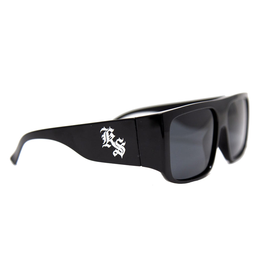 Kookslayer sunglasses, square flat-top frame with the KS monogram on the arm — angled
