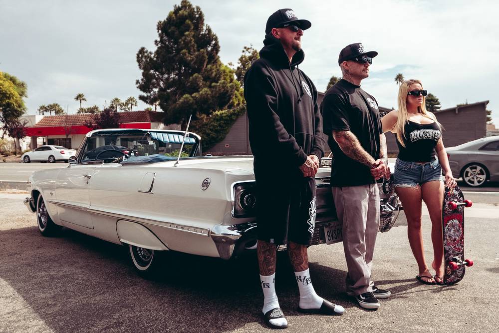 Kookslayer crew beside a white Chevy Impala