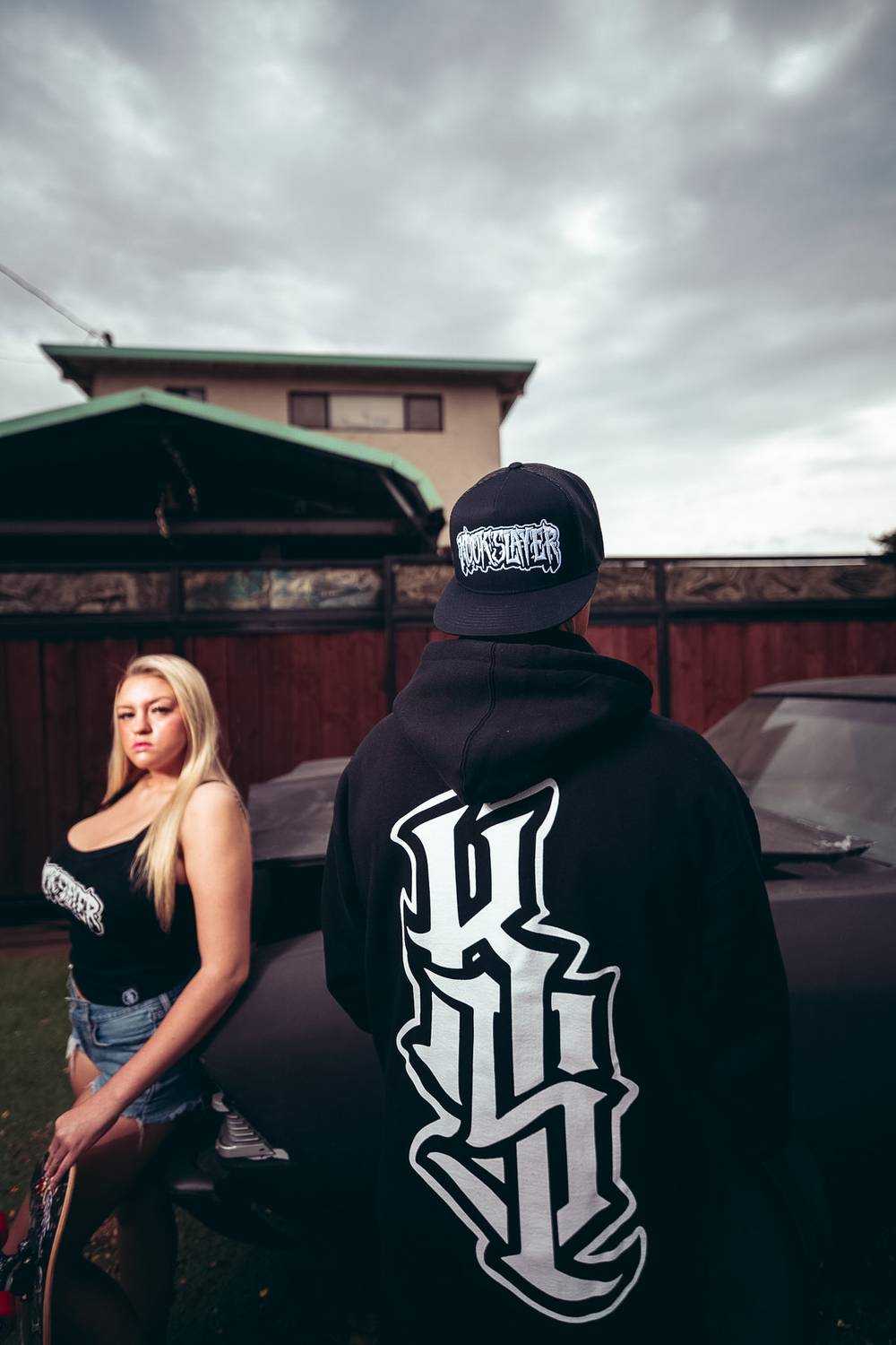 Back of the Kookslayer Hoodie beside a black Chevelle