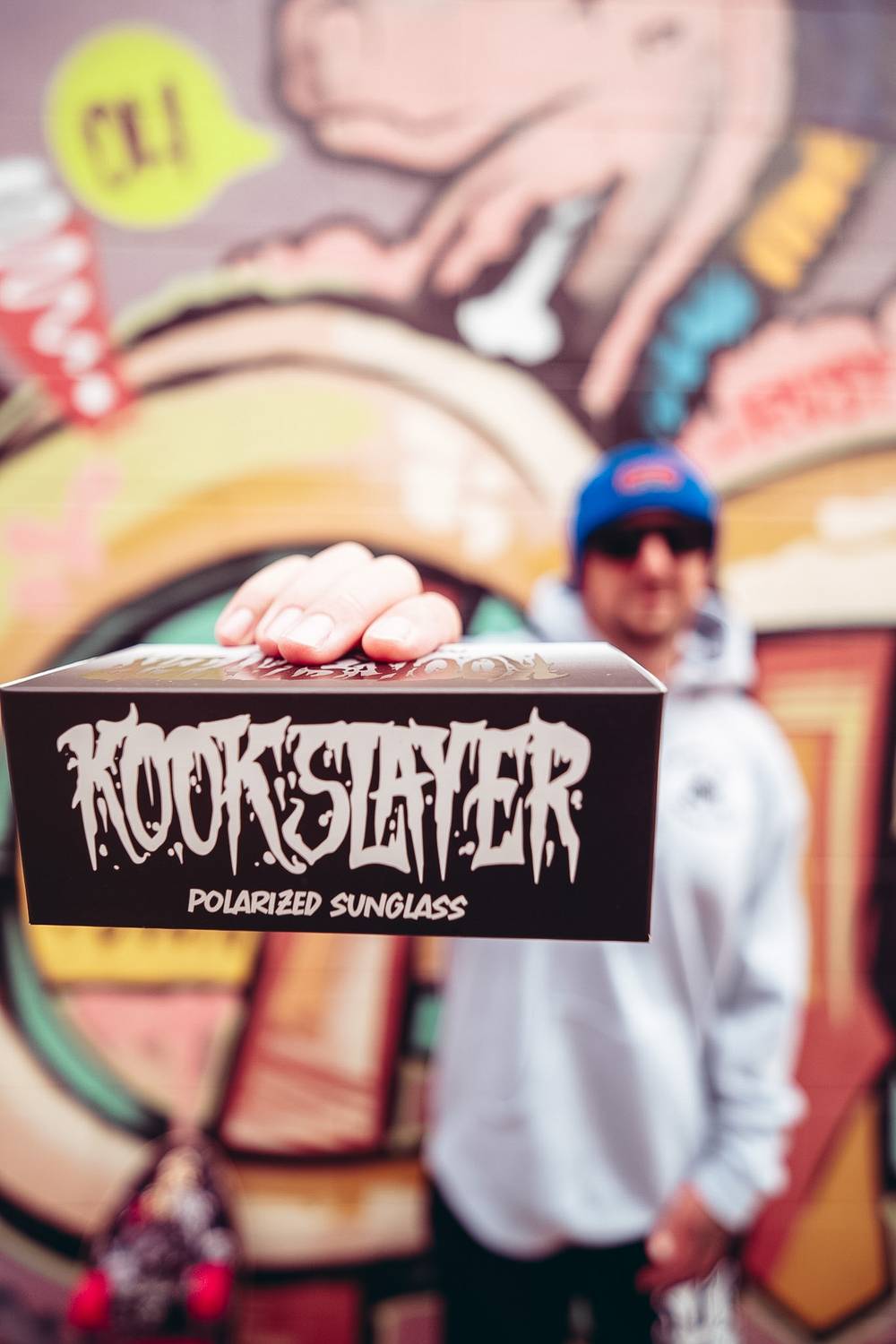 Kookslayer sunglasses box held up to the camera